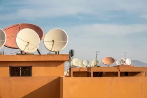 1 wide-angle-shot-white-satellite-dishes-roof-building