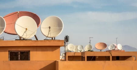 1 wide-angle-shot-white-satellite-dishes-roof-building