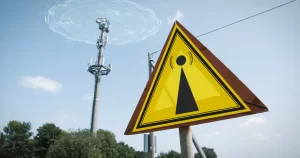 emf-warning-sign-5g-tower-causing-radiation-blue-sky